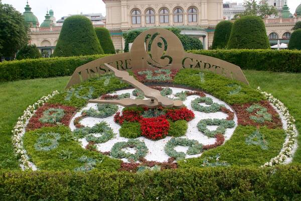 Landstraße showing flowers, a park and signage