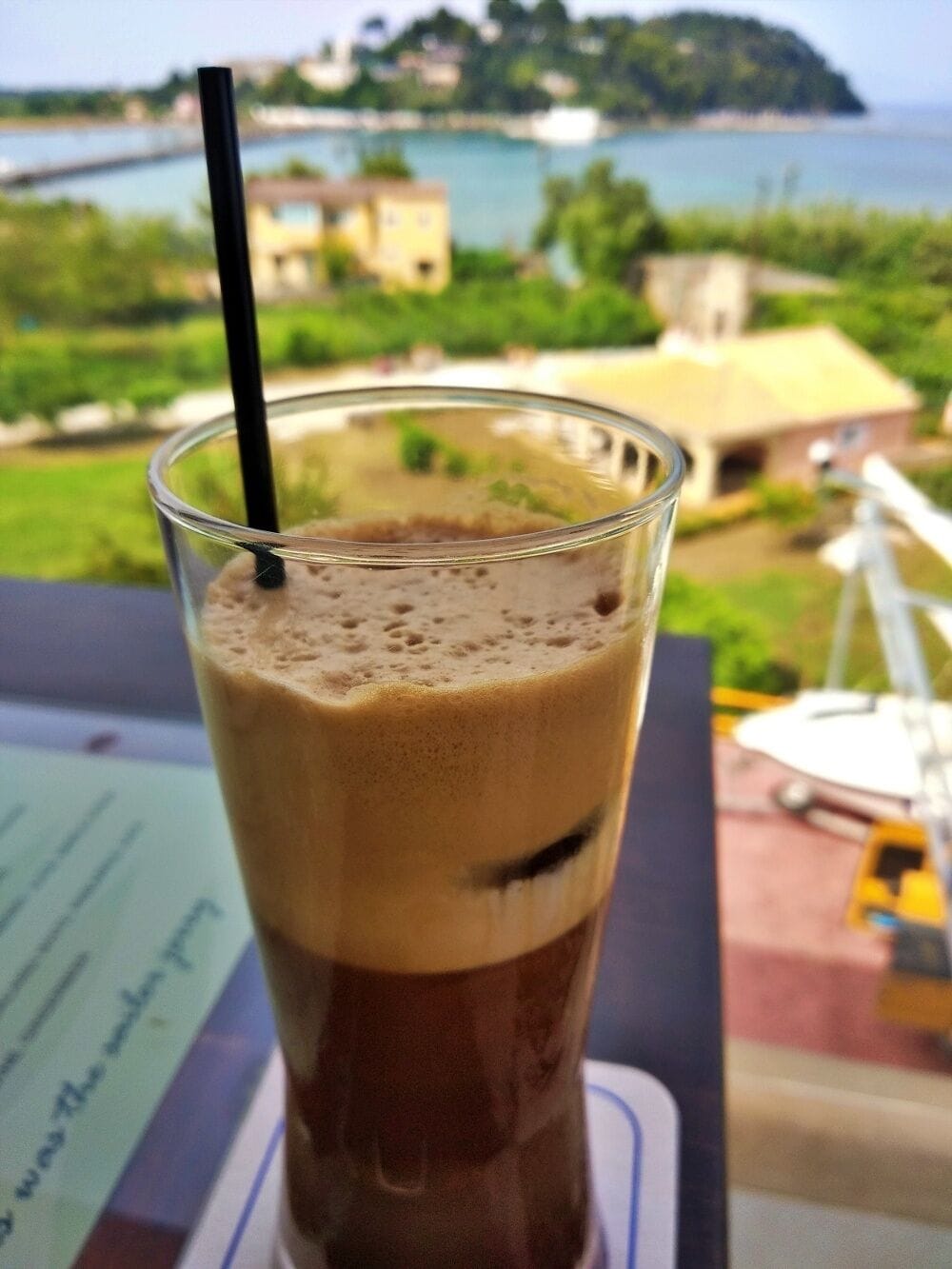 A Greek frosted frape with a view of Pontikonisi on the beautiful island of Corfu, Greece!