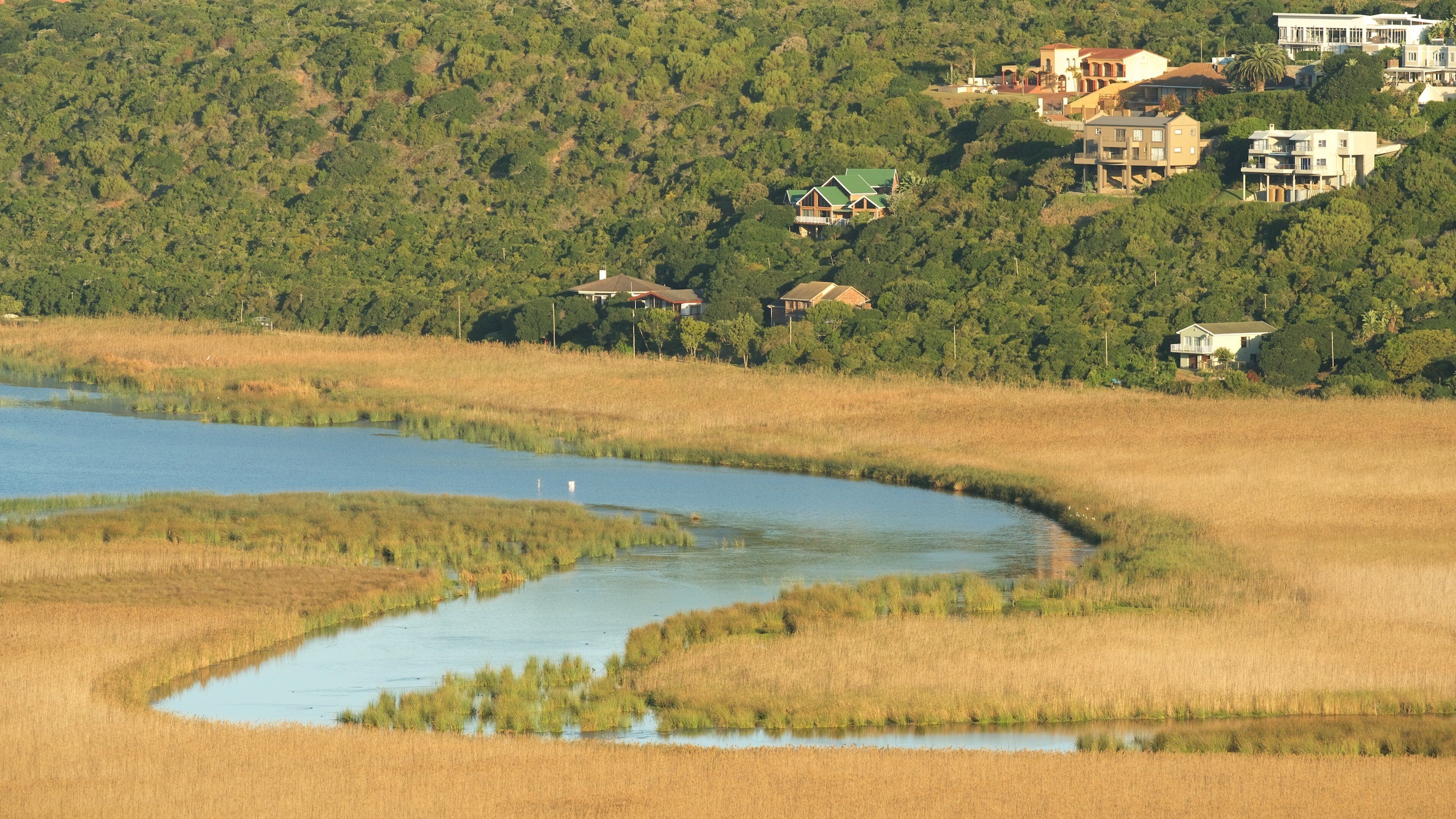Garden Route showing a small town or village, a river or creek and landscape views