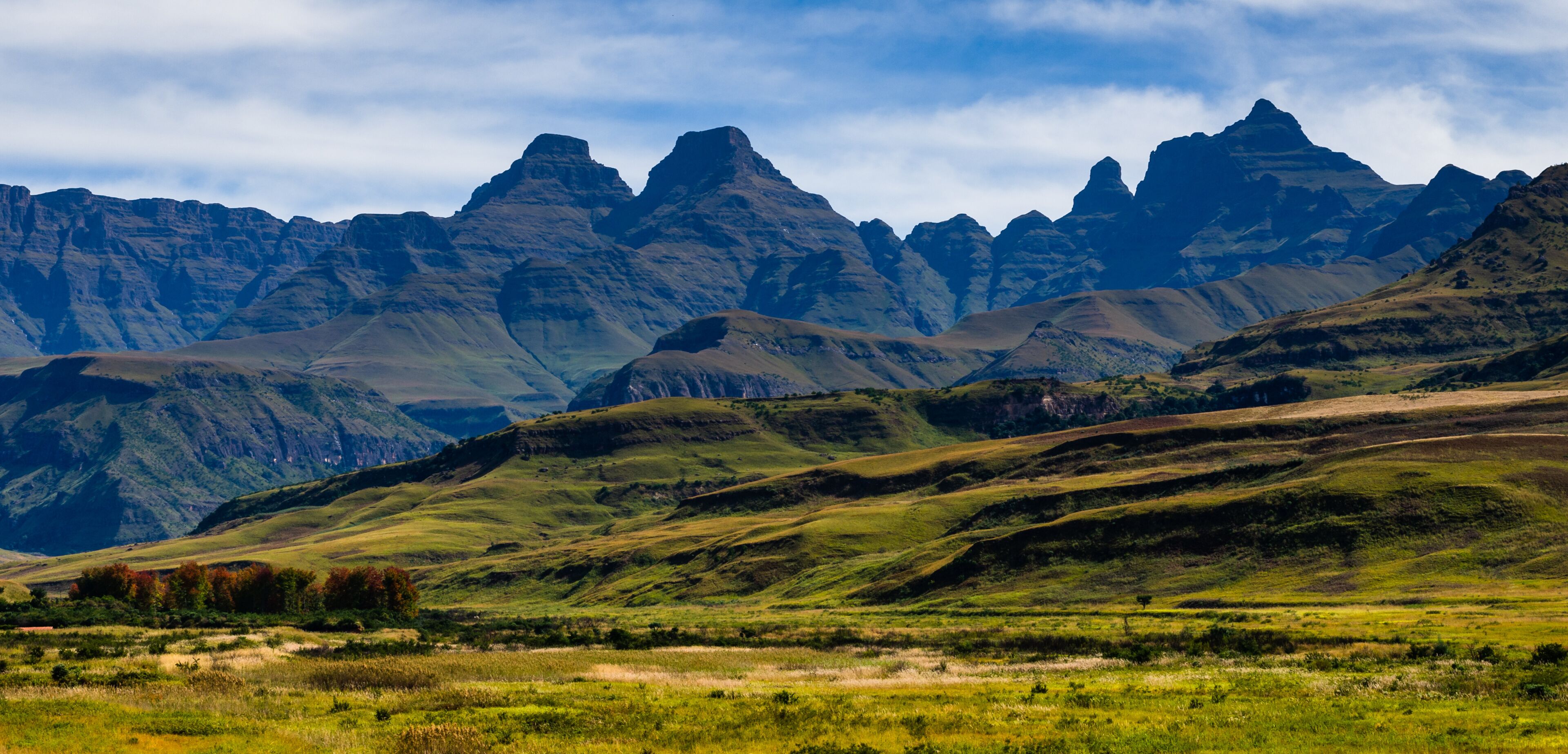 A mountainous landscape with rolling hills and a valley.