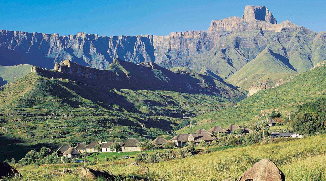 Drakensberg Mountains which includes tranquil scenes, a small town or village and mountains
