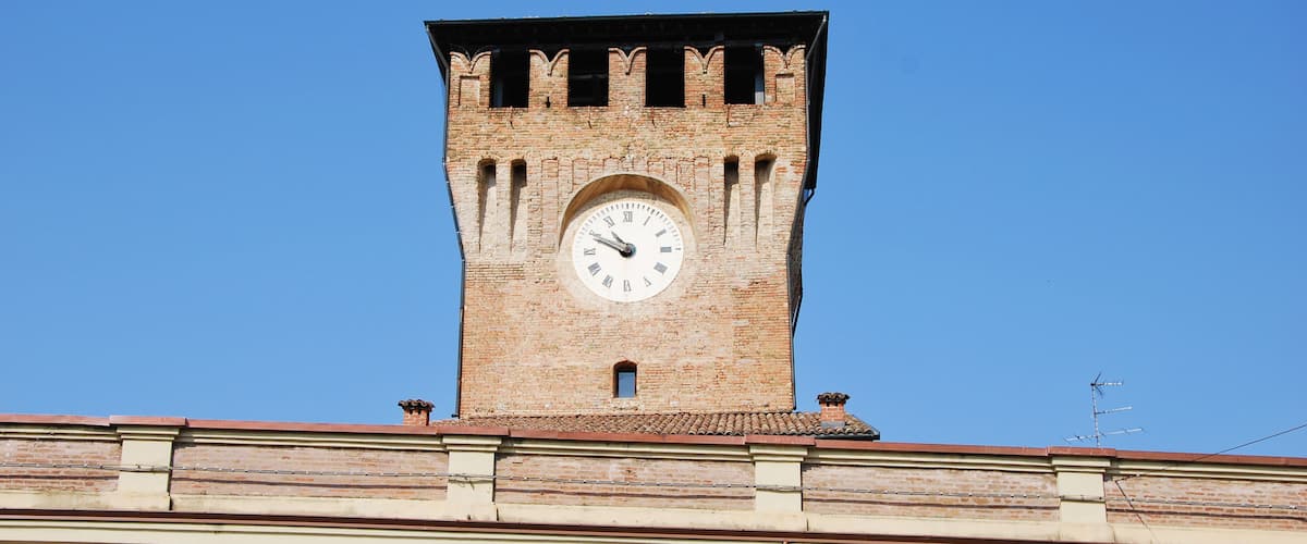 A clock tower with a clear blue sky in the background.