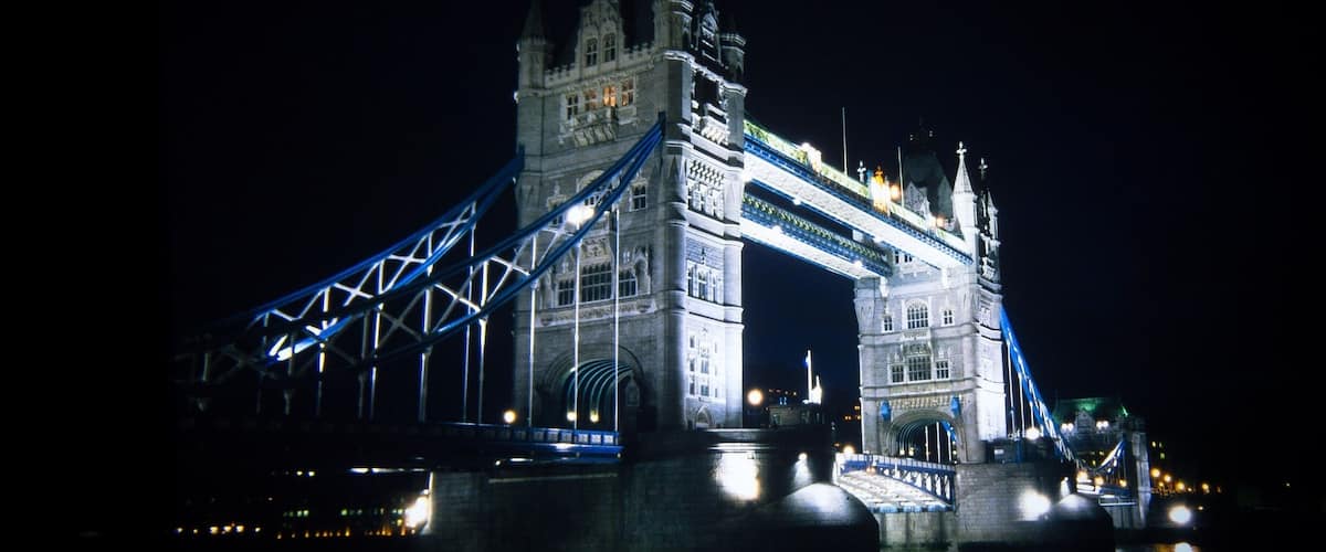 The illuminated Tower Bridge at night.