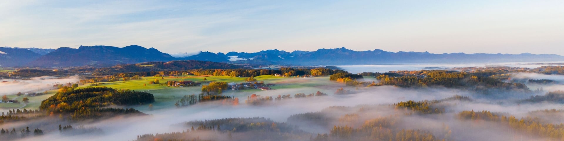 Aerial shot of fogs covering the municipality of Bad Endorf in Bavaria, Germany
