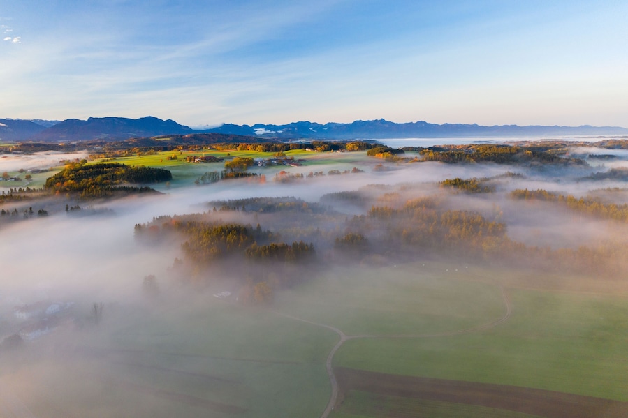Aerial shot of fogs covering the municipality of Bad Endorf in Bavaria, Germany