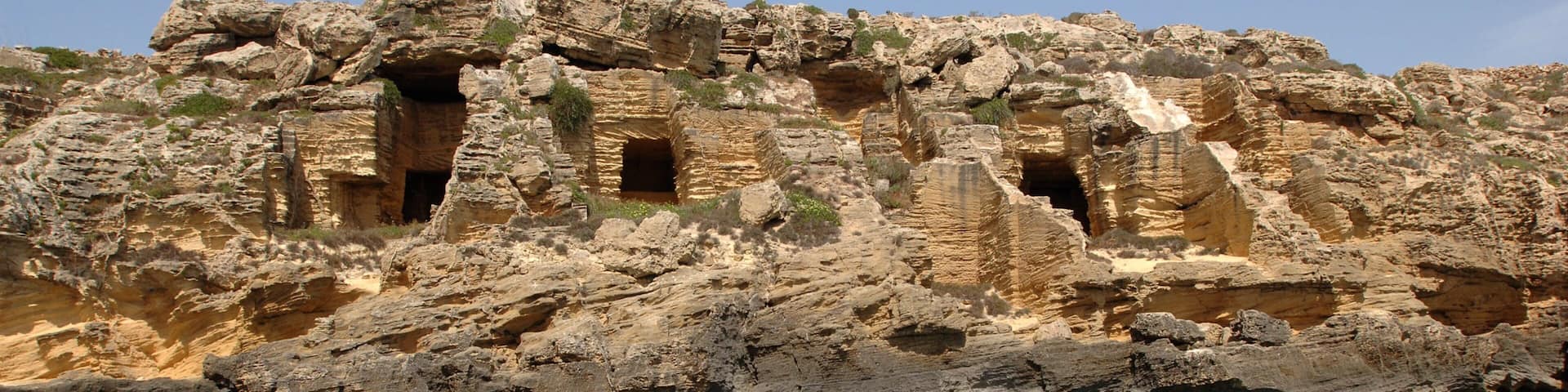 Favignana showing rugged coastline and heritage elements