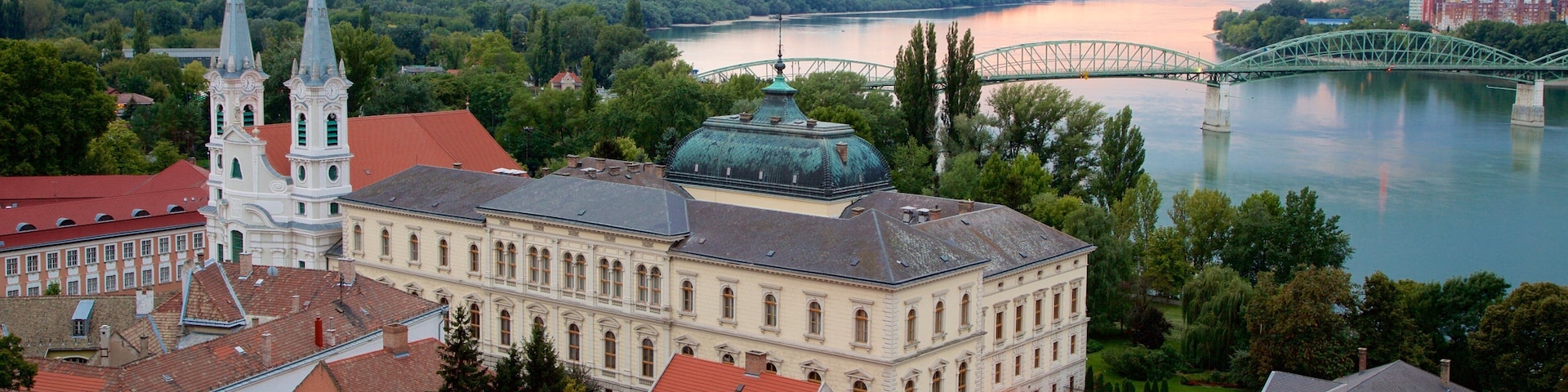 Esztergom showing a bridge, a church or cathedral and a sunset