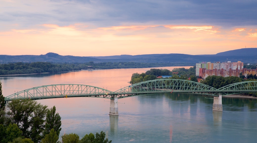Esztergom showing a bridge, a sunset and a river or creek