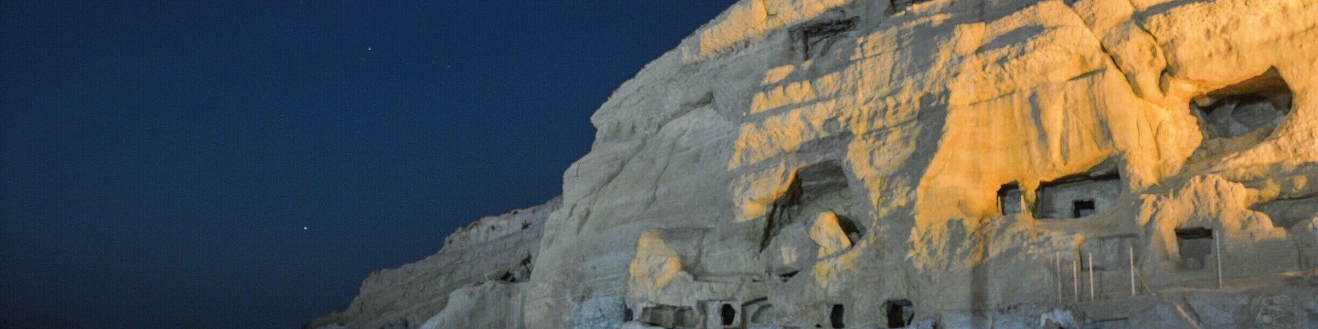 Above the beach at Matala, on the south coast of Crete, are a number of caves carved into the cliffside. During the Roman rule of Crete, the caves housed tombs. In the 1960s, the by-then empty caves hosted hippies who used them to camp out in. Matala still has a slight counter-culture feel to it.