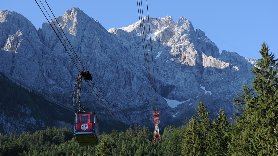 Zugspitze which includes a gondola, mountains and forests
