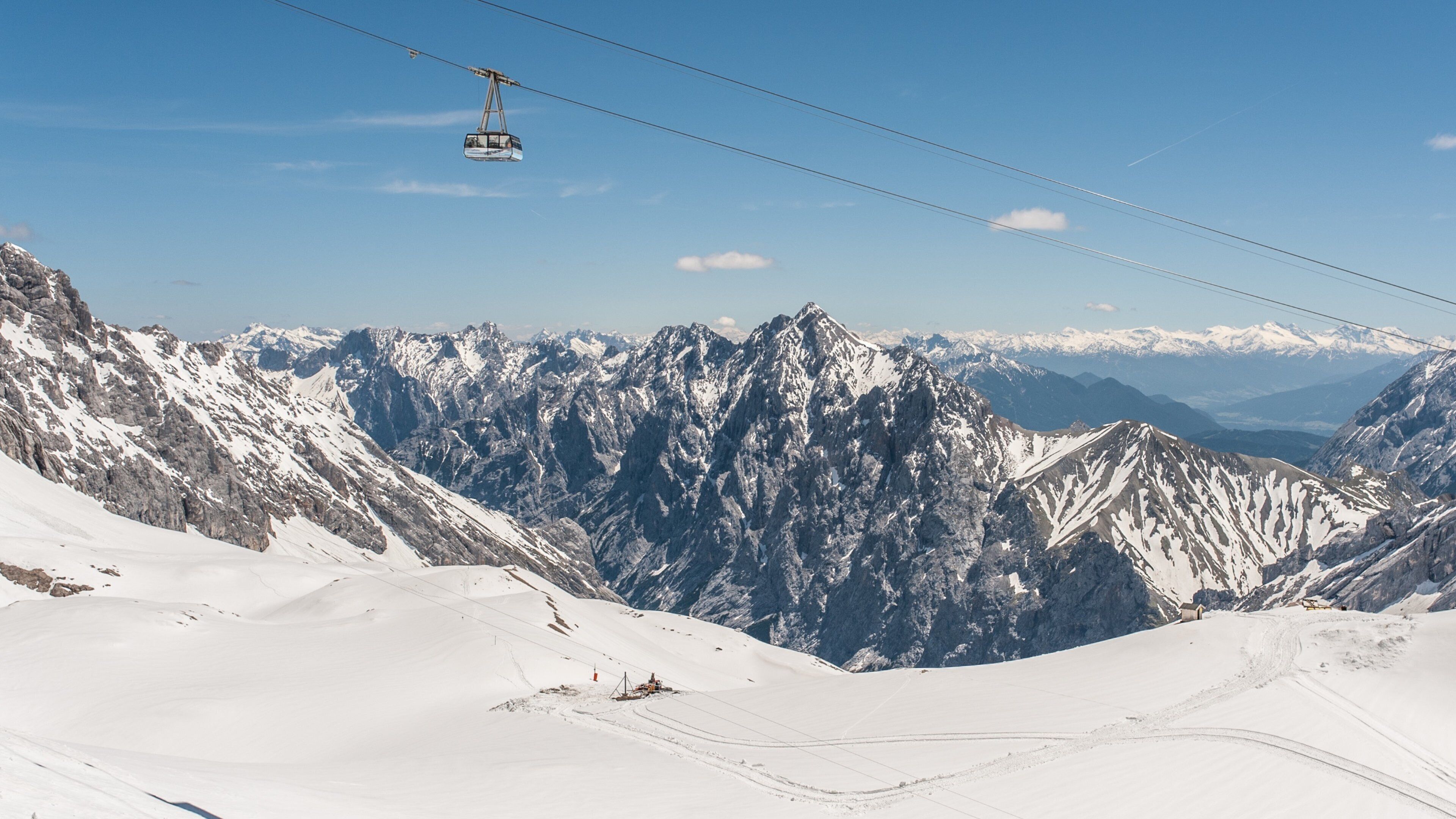 Zugspitze which includes a gondola, snow and mountains