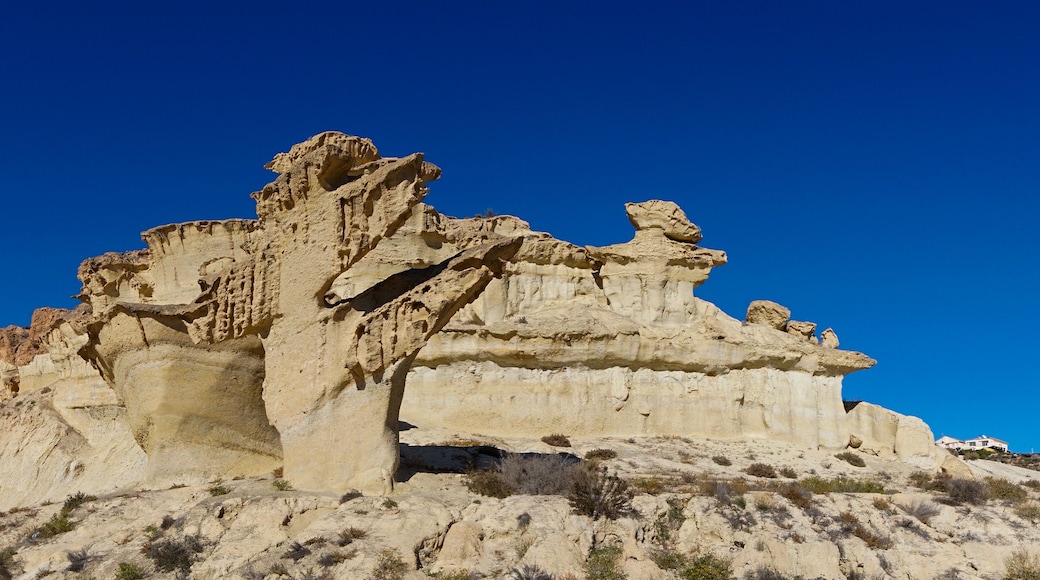 view of the famous sandstone erosions and hoodoos in Bolnuevo under a clear blue sky