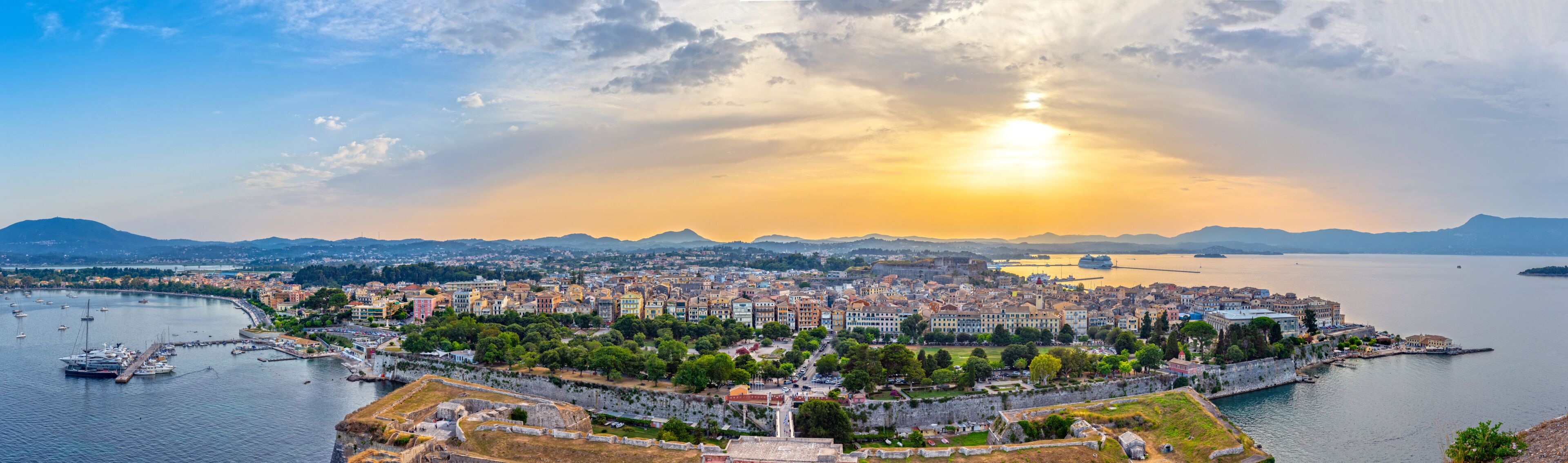 Kerkyra, capital of Corfu island at sunset, Greece. Panoramic view.