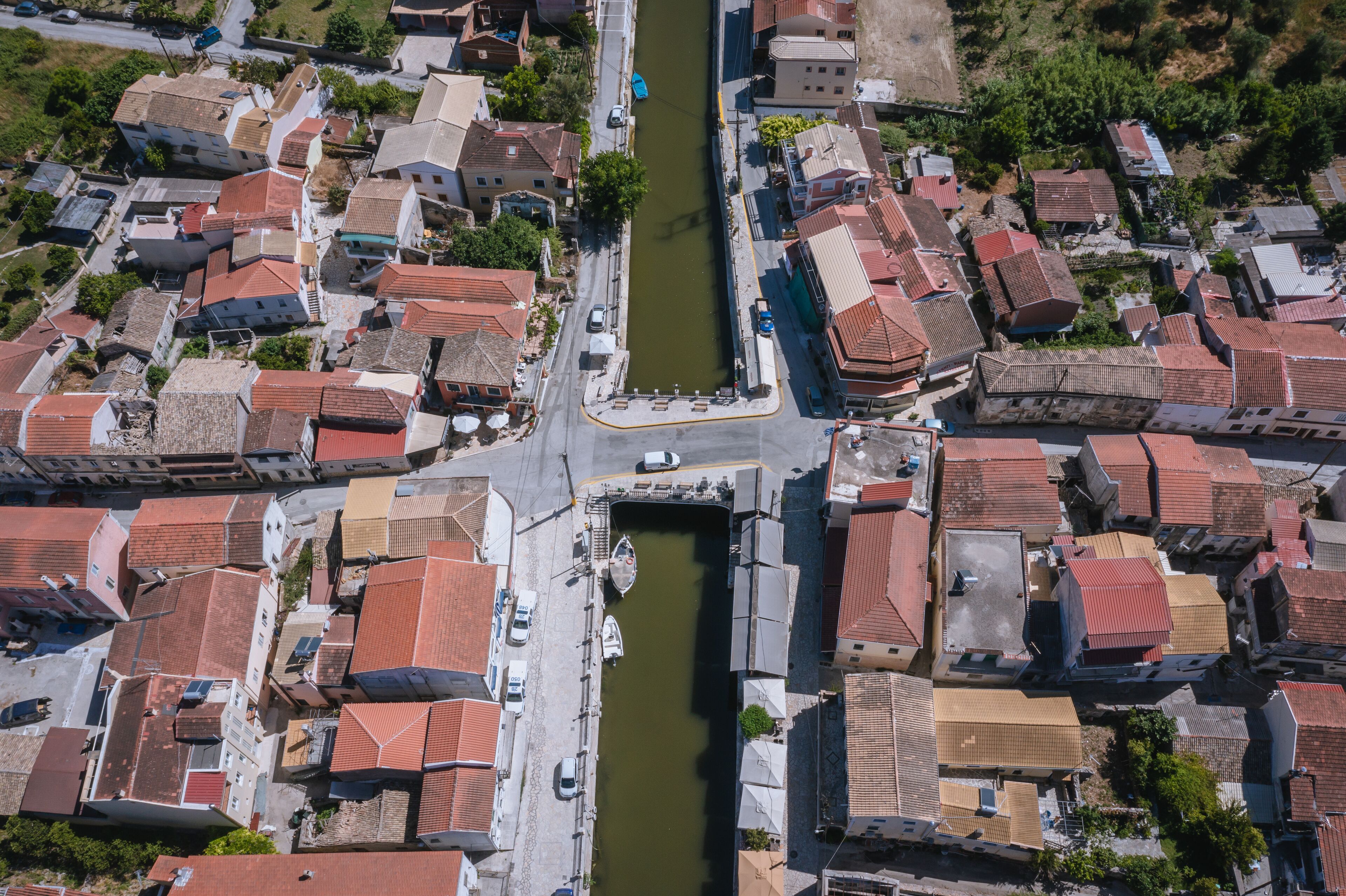 High angle drone view of water canal in Lefkimmi, small town on Corfu - Kerkyra Island, Greece