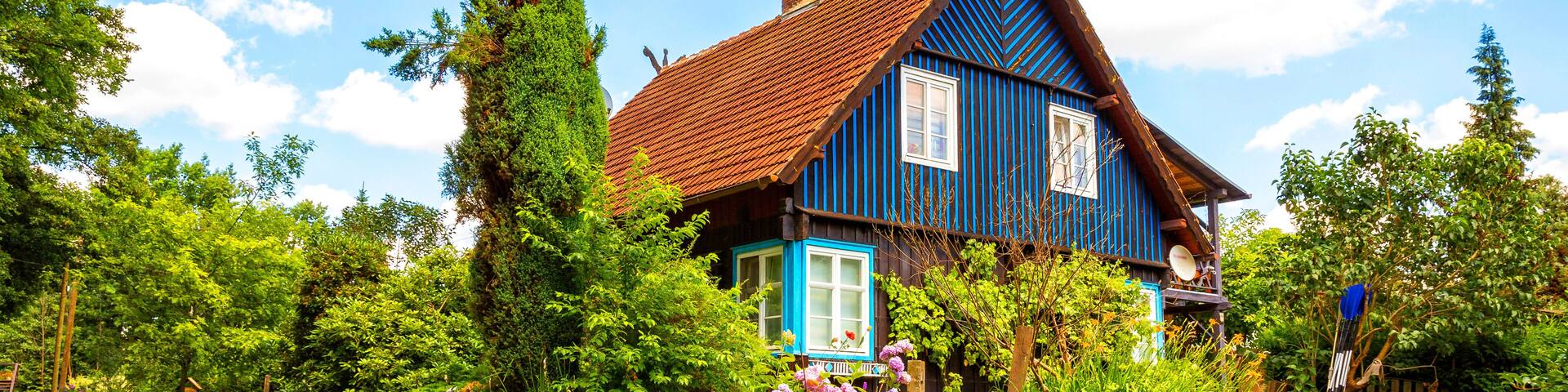 beautiful old half-timbered house on a water canal in the spreewald, brandenburg, germany
