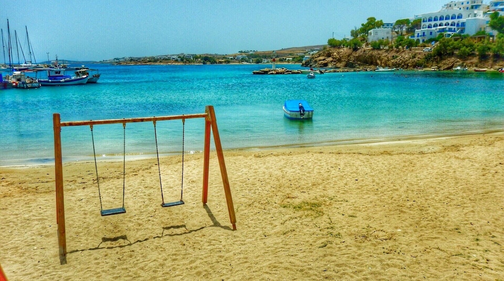 A beautiful little fishing village on the island of Paros, Greece with great waterside restaurants, and a play park on the beach!