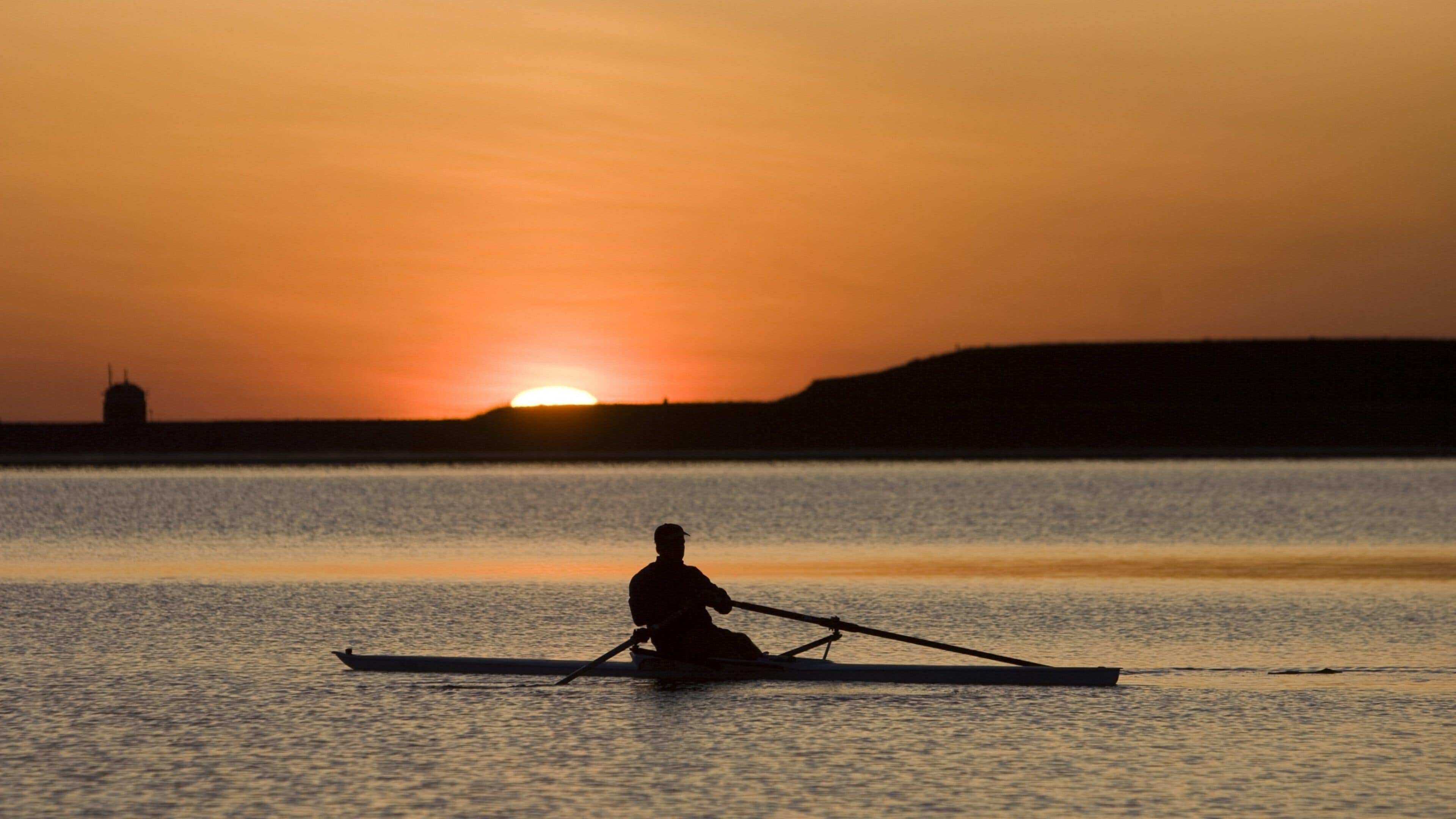 Boulder showing kayaking or canoeing, general coastal views and a sunset