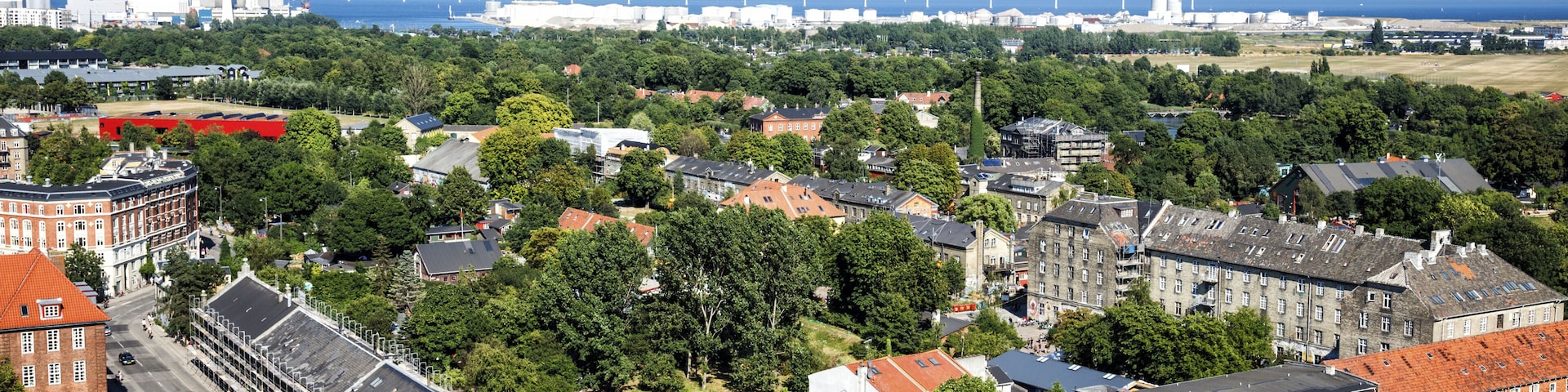 Freetown Christania in Copenhagen viewed from the top of Church of Our Savior with Kloevermarken (football fields), power plant Amagervaerket and Sweden in the background.