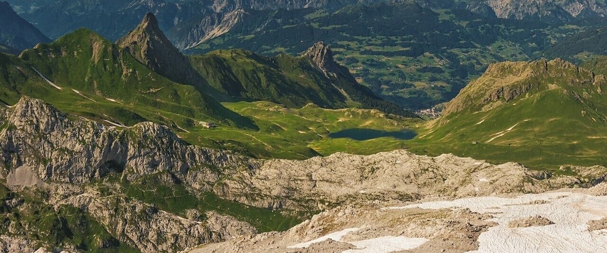 A mountain range with prominent peaks and a valley.