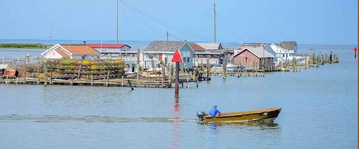 A coastal village with wooden houses and docks.