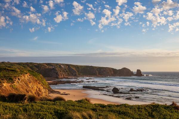 Cape Woolamai beach, looking towards the Pinnacles rock formation at sunset; Phillip Island, Victoria, Australia