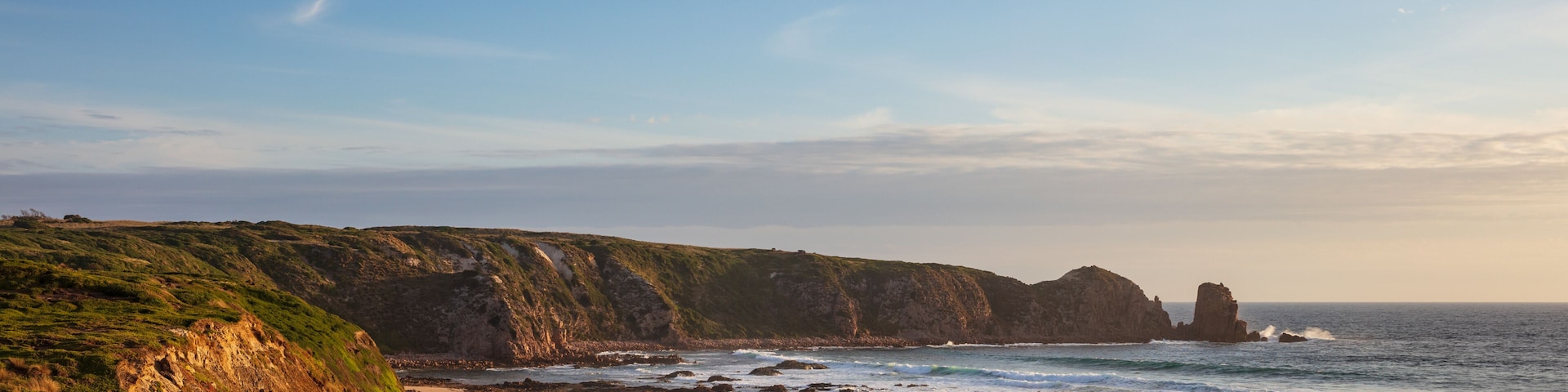 Cape Woolamai beach, looking towards the Pinnacles rock formation at sunset; Phillip Island, Victoria, Australia