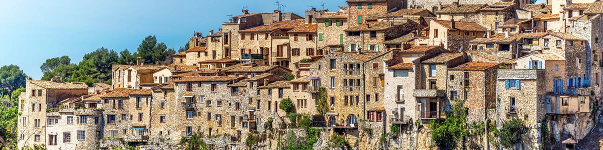 Panoramic view of Tourrettes-sur-Loup medieval village from Cassan Valley. Southeastern France, Alpes Maritimes.