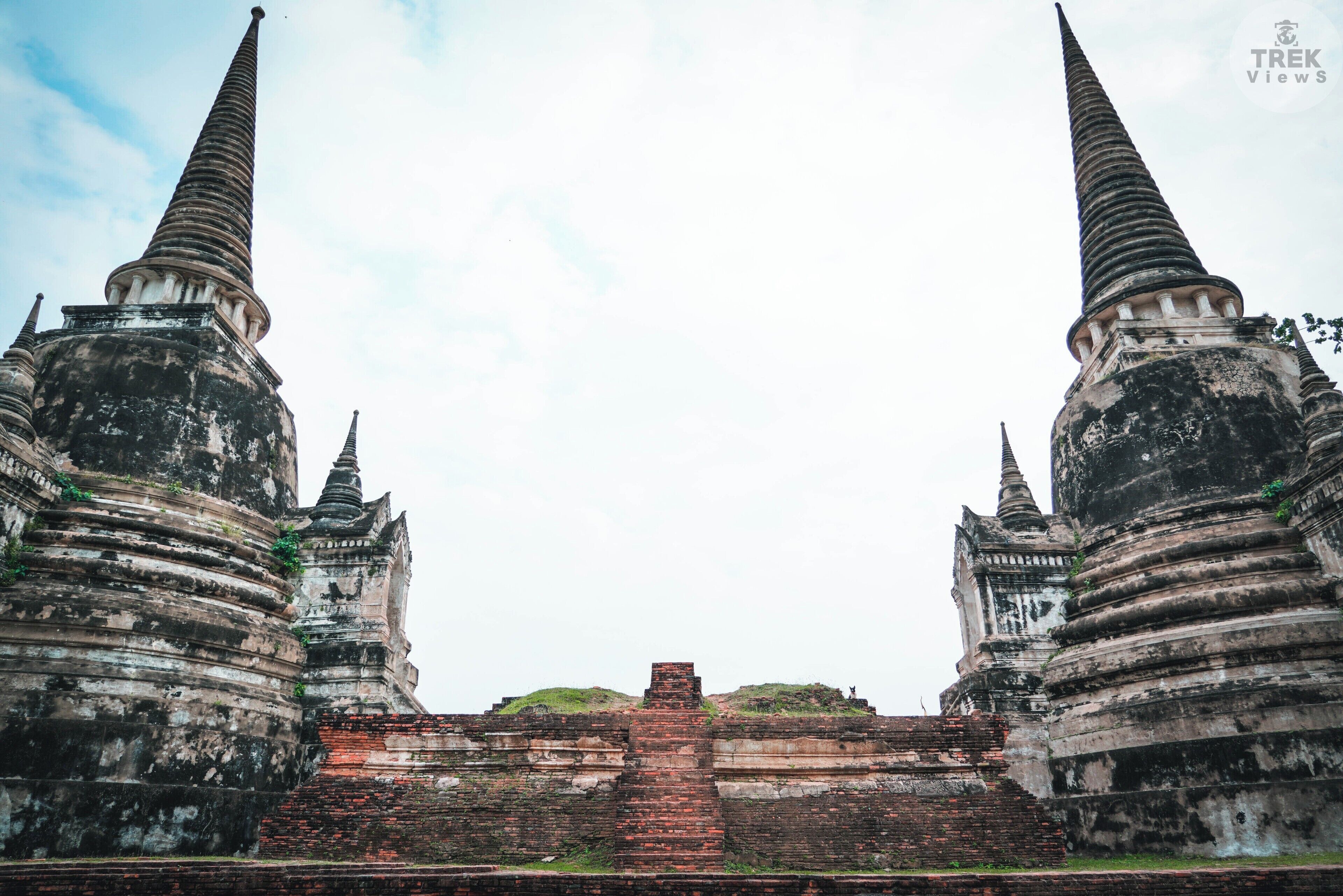 Temple Views | Wat Pra Si Sanphet: Two of the magnificent Chedis on the temple grounds. Before becoming a temple, the grounds of Wat Pra Si Sanphet was the palace of King Ramathibodi I. In 1448 King Borommatrailokanat built a new palace to the north and the old palace grounds was converted into a holy site. Three Chedis were built in 1492 by the order of his son King Ramathibodi II with two of them used to house his ashes and the ashes of his brother, King Borommaracha III. It’s nice to be a King! I wouldn’t mind at all having something so grand dedicated to me when I pass. Oh the woes of not having blue blood.
.
.
.
.
#sonyalpha #sonya7riii #traveler #travellife #travelphotography #travelpics #travelgram #wanderer #wanderlust #instagood #instatravel #troveon #yourshotphotographer #lpfanphoto #travelsoutheastasia #travelthailand #southeastasia #thailand #visitthailand #beautifulseasia #igthailand #thailandinsider #amzthld #vscothailand #ayutthaya #ancientcity #ruins #temple #buddhism #chedi 