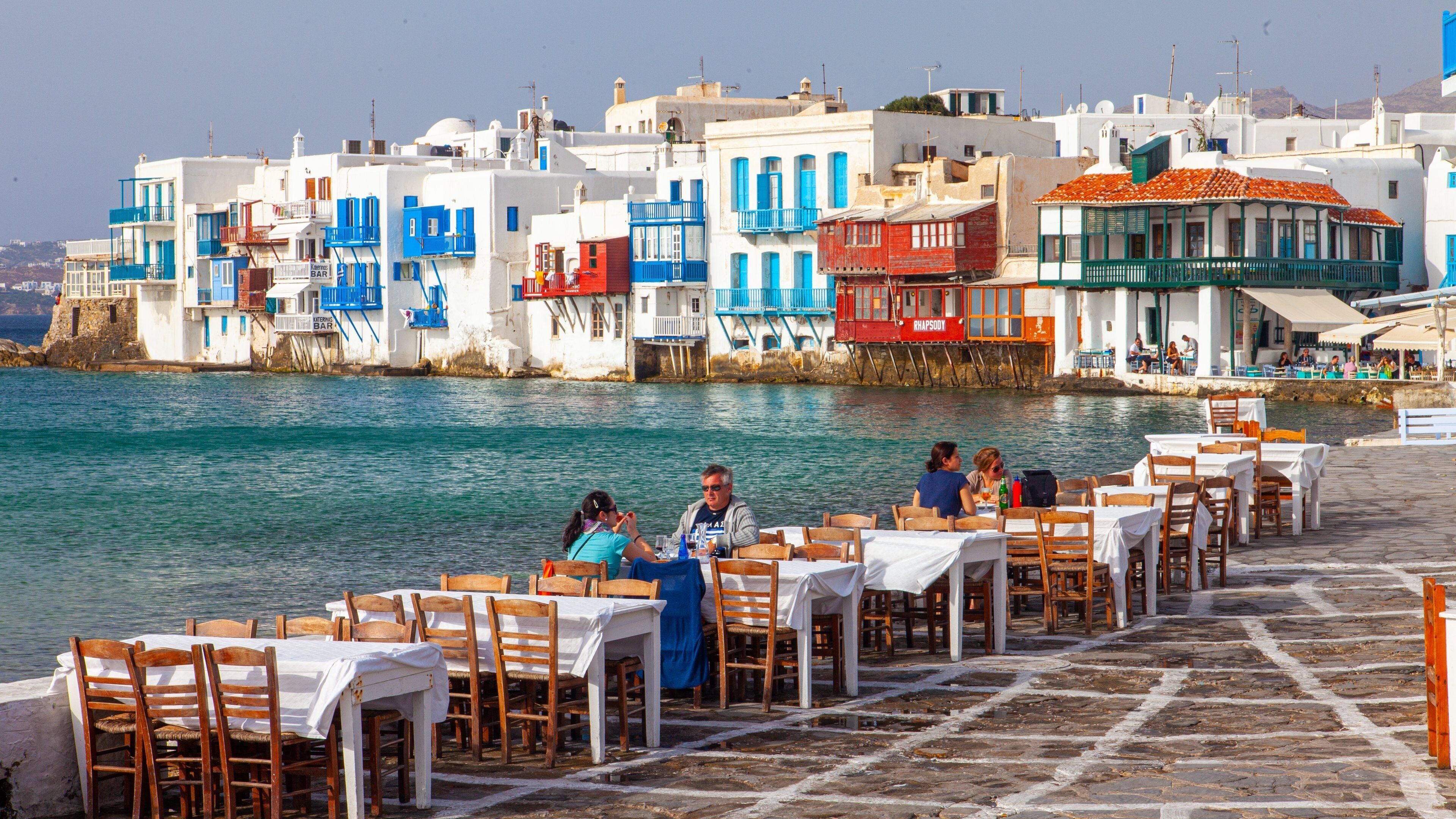 Greece showing general coastal views, outdoor eating and a coastal town