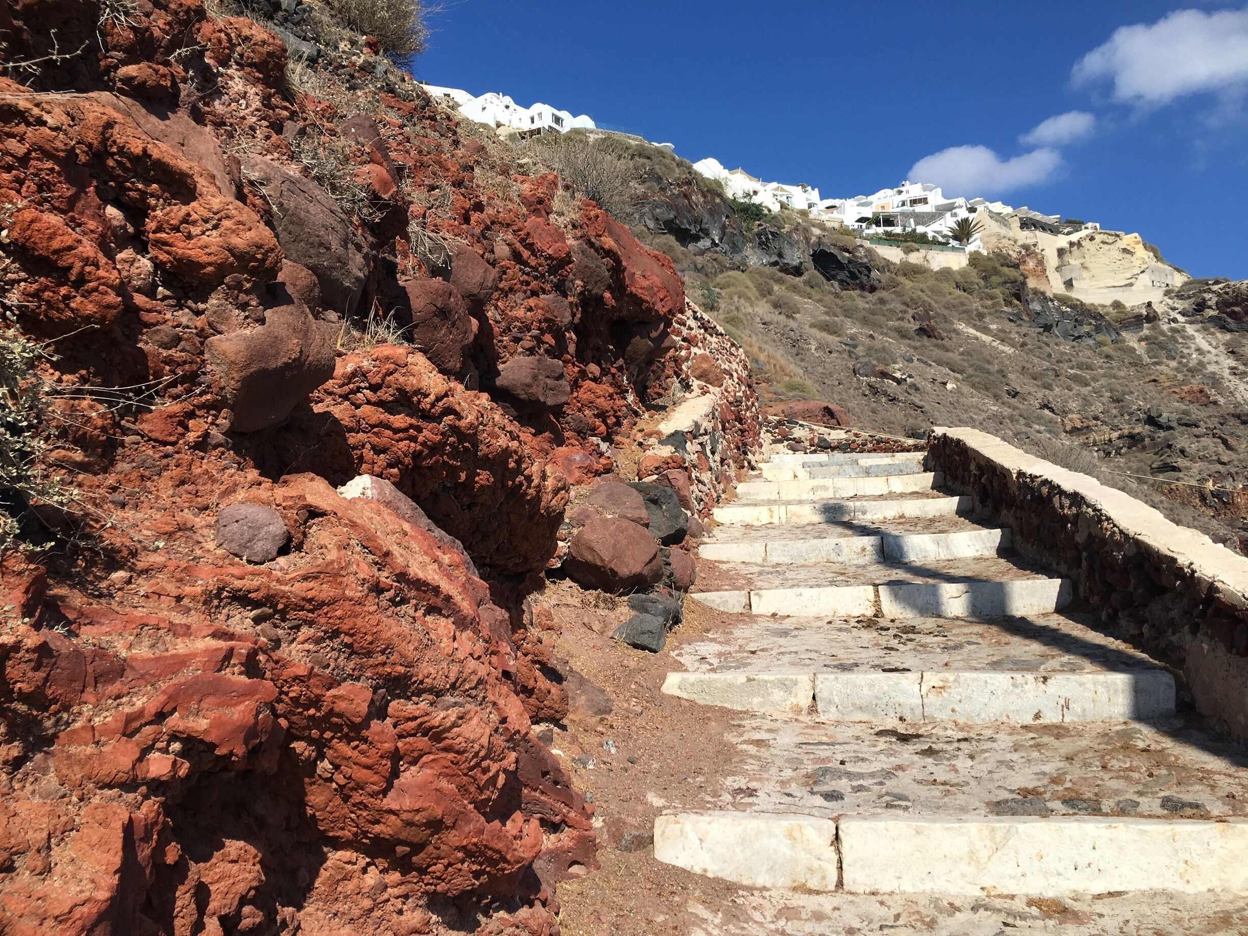 I decided to hike my way up atop the town of Oia from the port where the cruise alighted passengers. The hike up was No joke. The Aegean Sun at 3:00pm was sweltering. And on top of that , I had to share the path up with donkeys... thank god I didn’t step on donkey poop on my way up. 
#In stone
