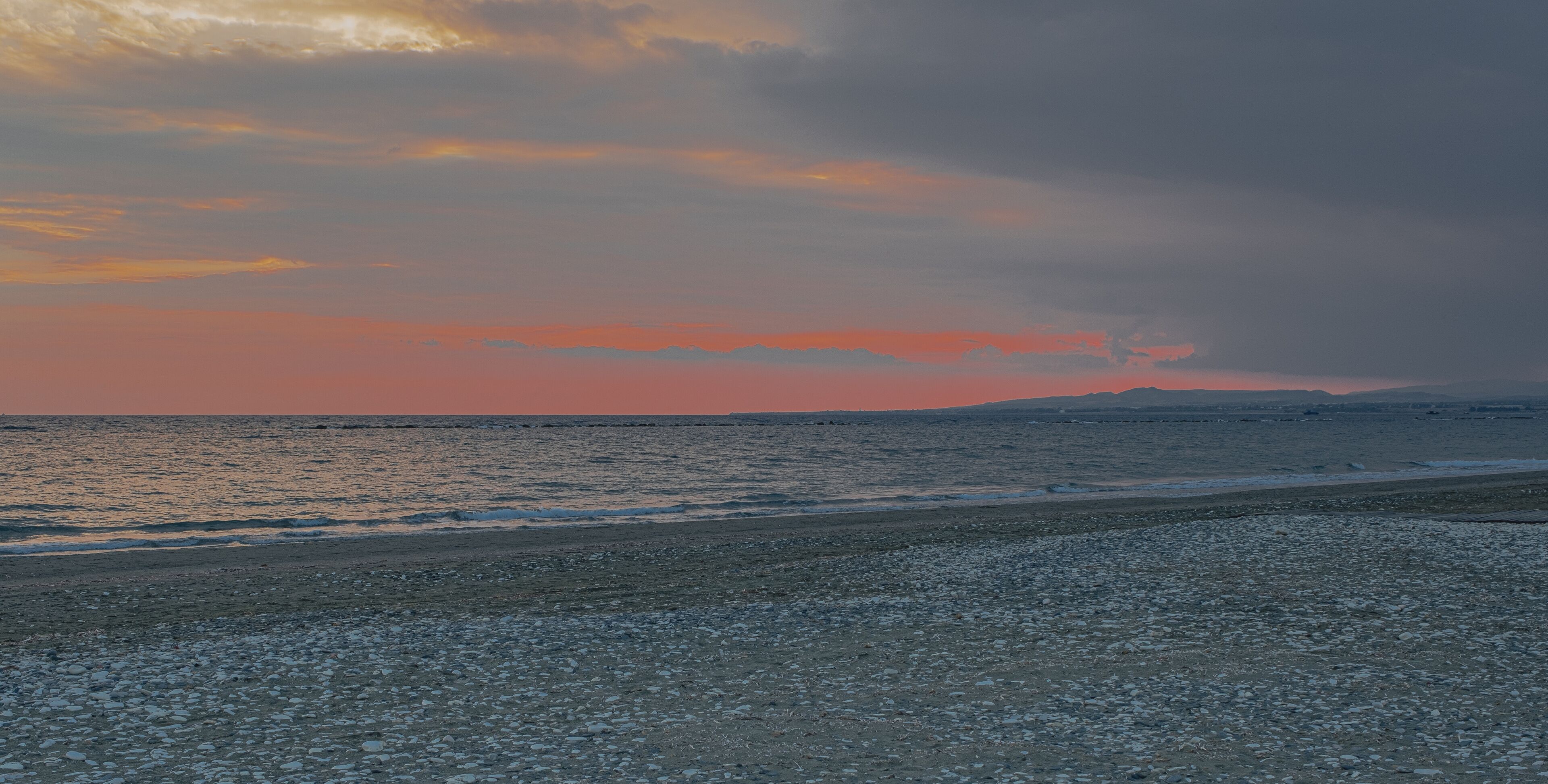 View of the Sunset along the Mediterranean Sea coastline of Pervolia village, south of Cape Kiti and south of Larnaca city, Cyprus 