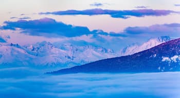 Scenic panorama sunset landscape of Crans-Montana range in Swiss Alps mountains with peak in background, Crans Montana, Switzerland.