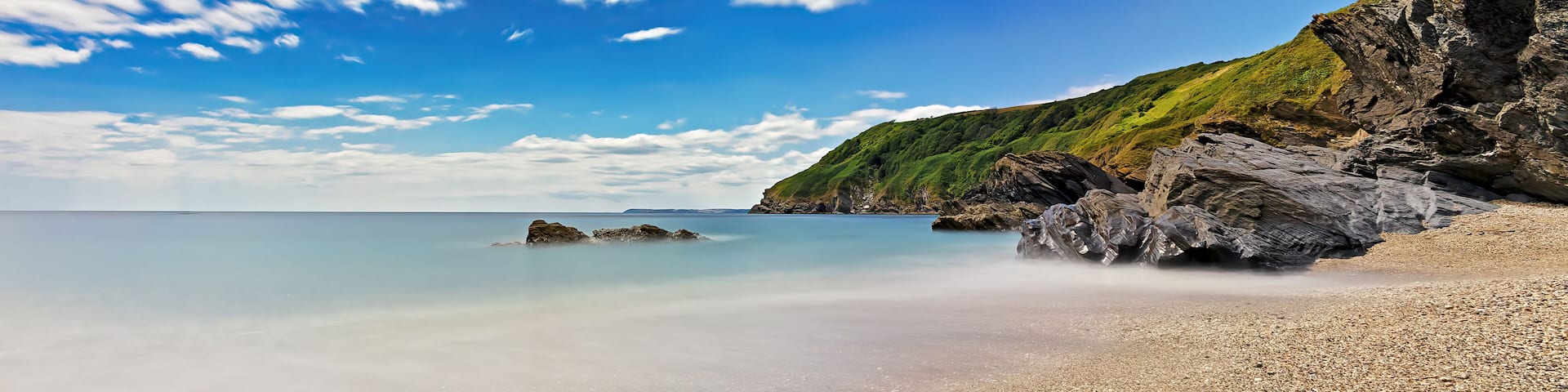 Background image, Cornwall coast in England, long exposure