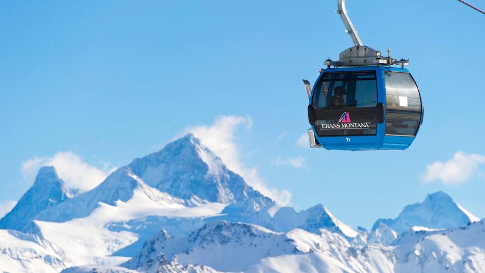 Crans-Montana Ski Resort showing mountains, a gondola and snow