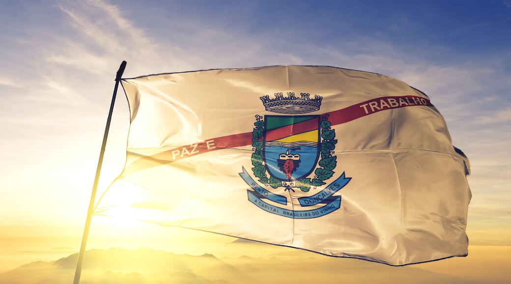 Bento Goncalves of Brazil flag waving on the top sunrise mist fog