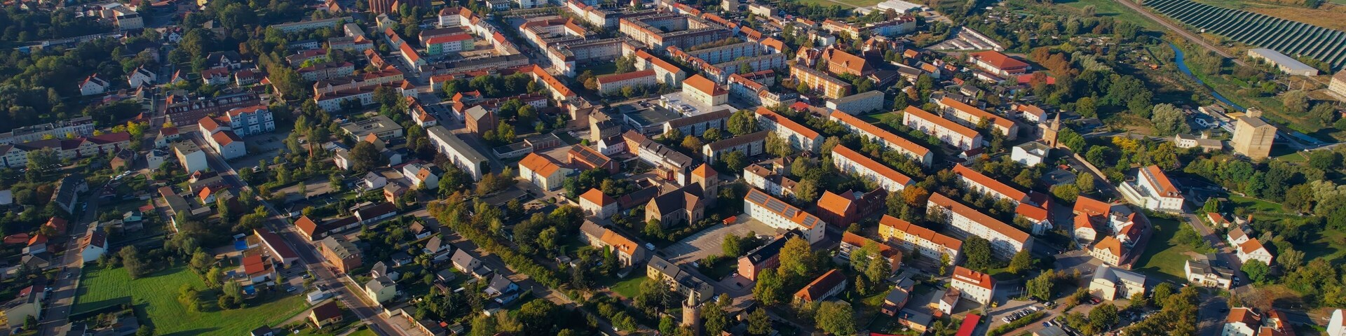 Aerial panoramic view around the old town of the city Pasewalk on a sunny morning in summer in Germany.