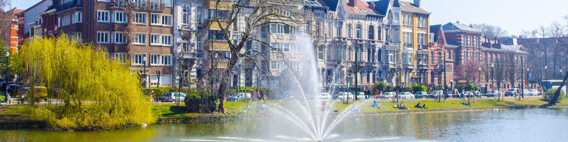 View over the artificial pond situated next to the flagey square in belgian brussels, where local citizens go to relax when sunny.