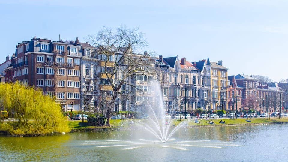 View over the artificial pond situated next to the flagey square in belgian brussels, where local citizens go to relax when sunny.