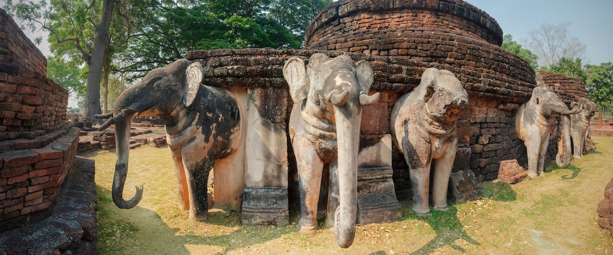 Ancient elephant statues in a temple complex.