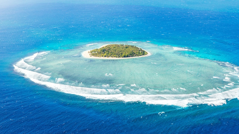 Panoramic aerial view of Tavarua, heart shaped island, Mamanucas, Fiji