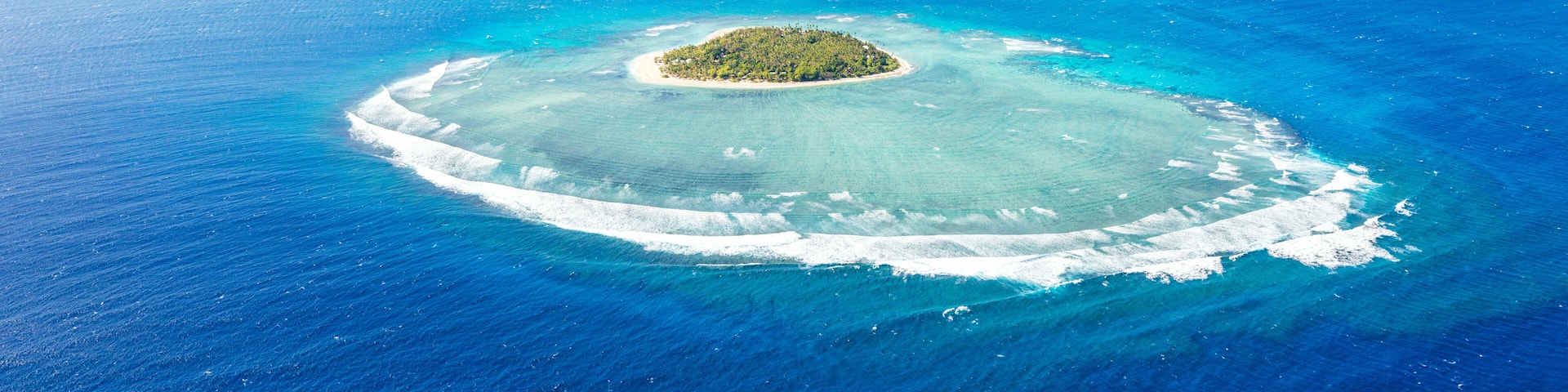 Panoramic aerial view of Tavarua, heart shaped island, Mamanucas, Fiji