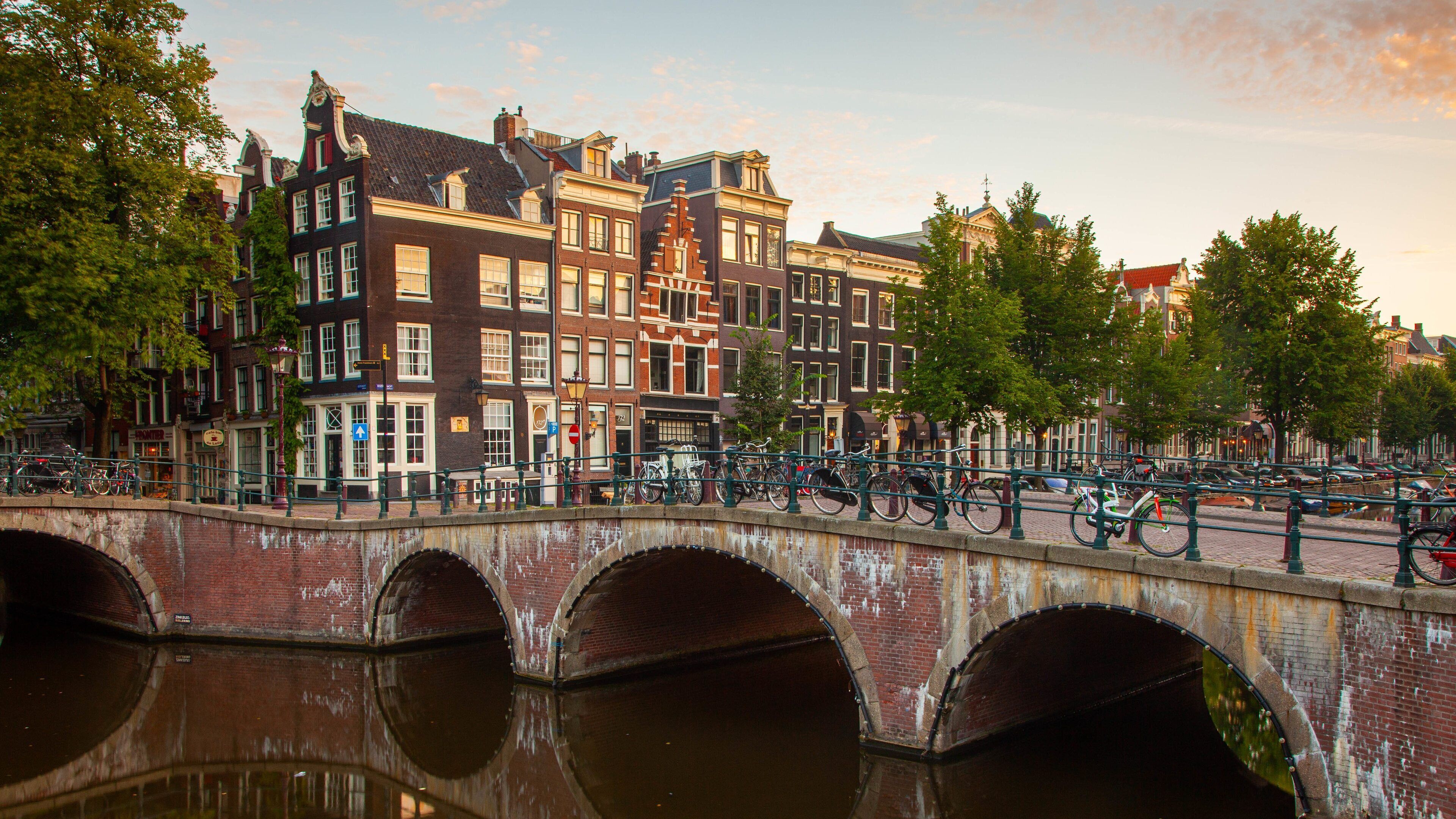 Canal Ring featuring a bridge, heritage elements and a sunset
