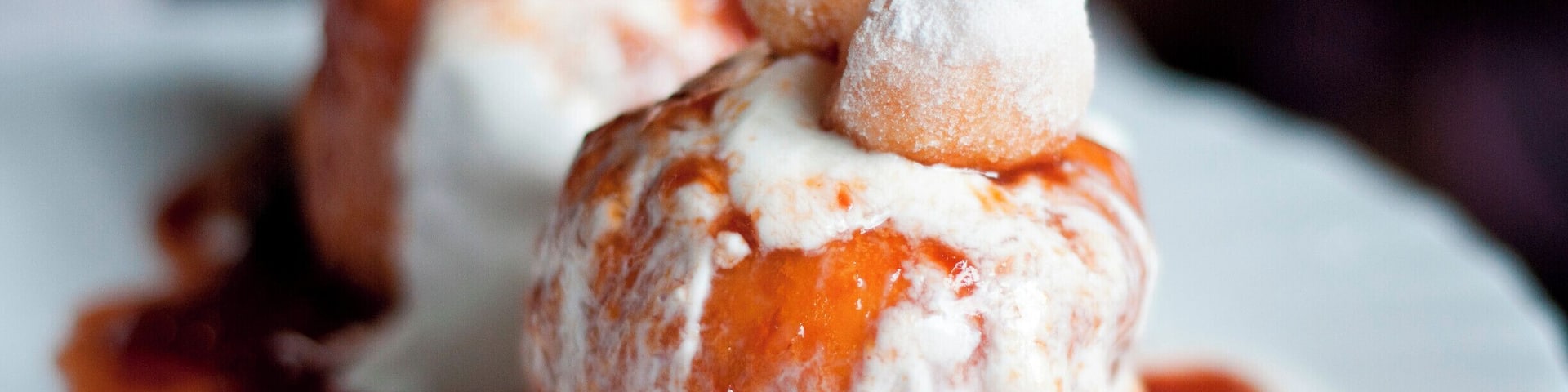 'Papanaşi |
What exactly is this dessert? Fried dumplings with sour cream and jam
What do I love about it? Well, it is an extraordinary dessert, you can combine it with many types of delicious Romanian homemade jams and it lights up my day whenever I taste it.
Best place to try it: Robinson Hotel in Predeal, 10, Muncii Street – the best and largest Papanaşi of my life!
Suggestion: My favourite jam for Papanaşi is sour cherry jam. Remember also that the more sour cream, the better! Just imagine soaking your piece of dough in the fresh sour cream combined with the caramelised jam... Mmmm...'
#delicious
P.S. Would you like to try a traditional dessert?
https://bit.ly/3ayF2Bw