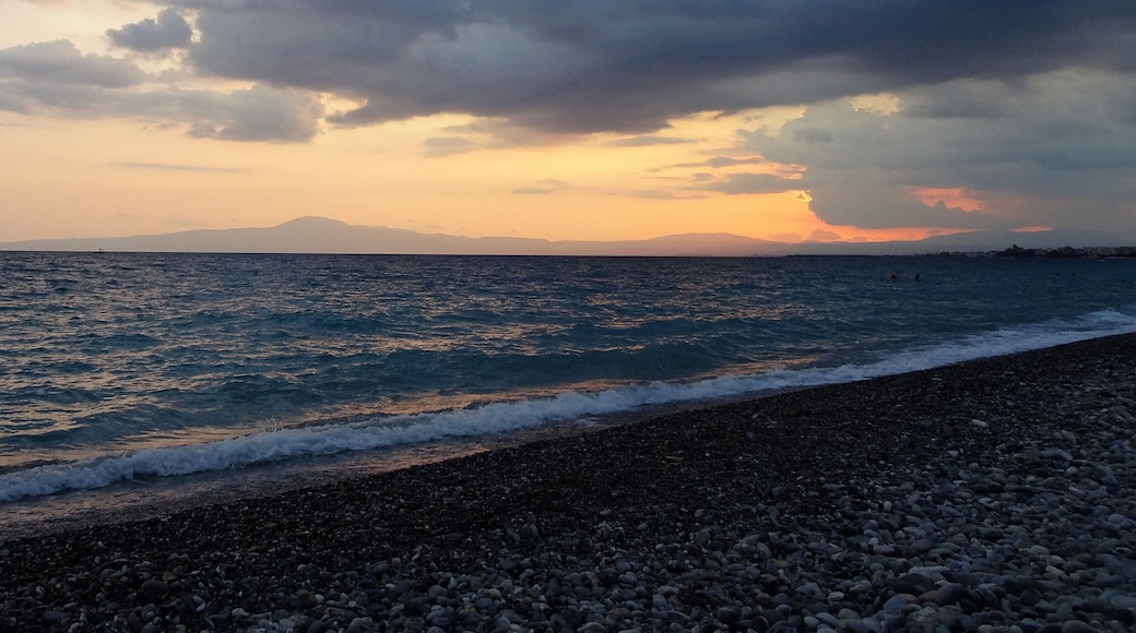 Bay of Kalamata: the setting sun makes way for dark thunderclouds.