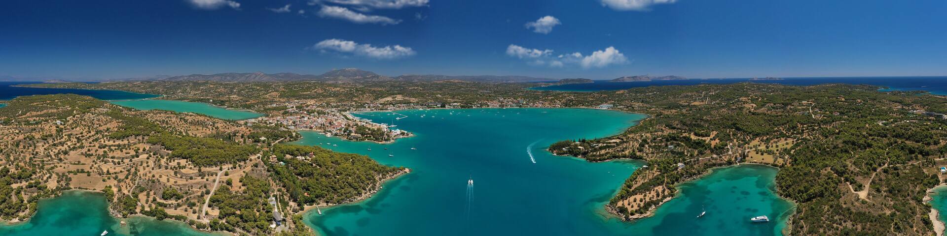 Aerial drone photo of famous fjord seaside village and bay of Porto Heli in the heart of Argolida prefecture, Peloponnese, Greece