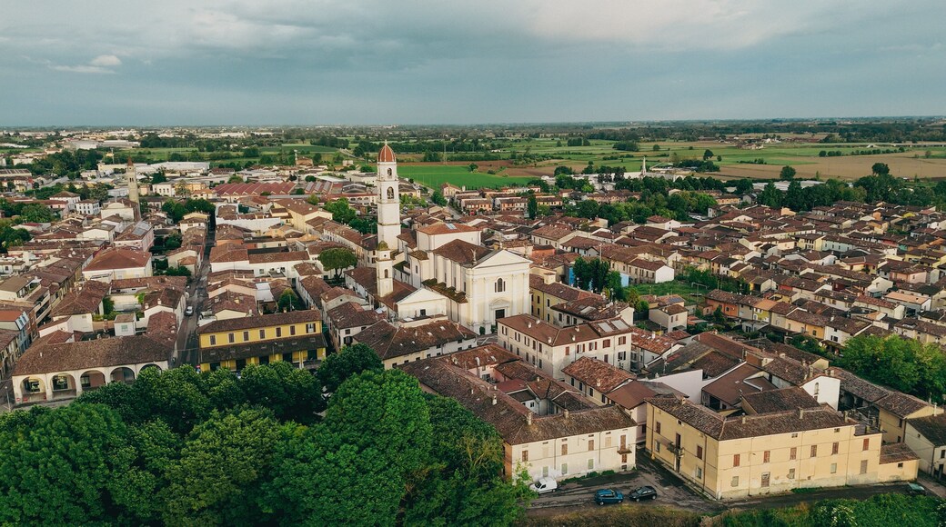 Breathtaking aerial views of the historic Italian town of Pontevico in the province of Brescia Italy showcasing its charming architecture and scenic landscape under a dramatic sky