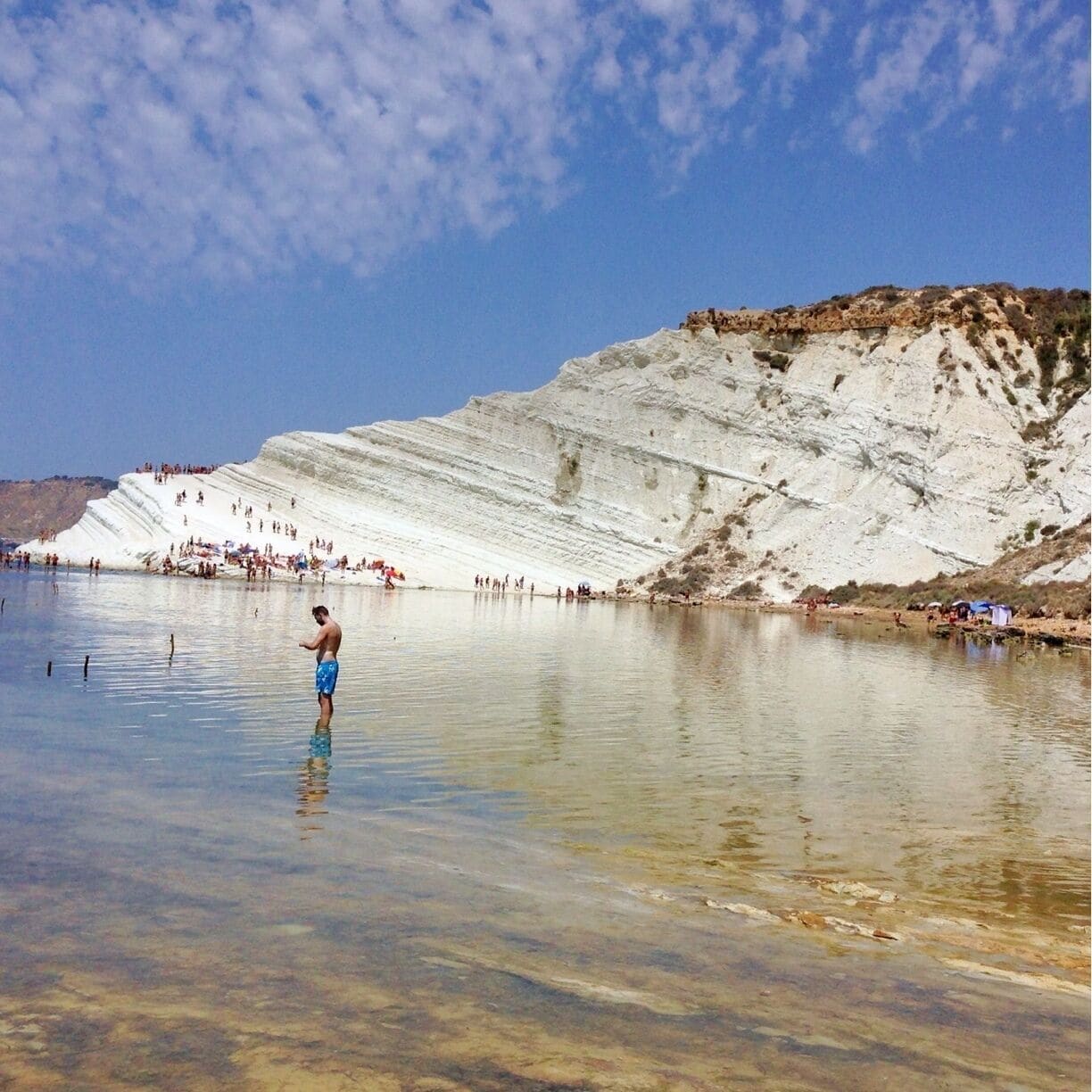 The Scala dei Turchi (Italian: "Stair of the Turks") is a rocky cliff on the coast of Realmonte, near Porto Empedocle, southern Sicily, Italy. It has become a tourist attraction due to its unusual white color, as well as by its mention in Andrea Camilleri's series of detective stories about Commissario Montalbano.