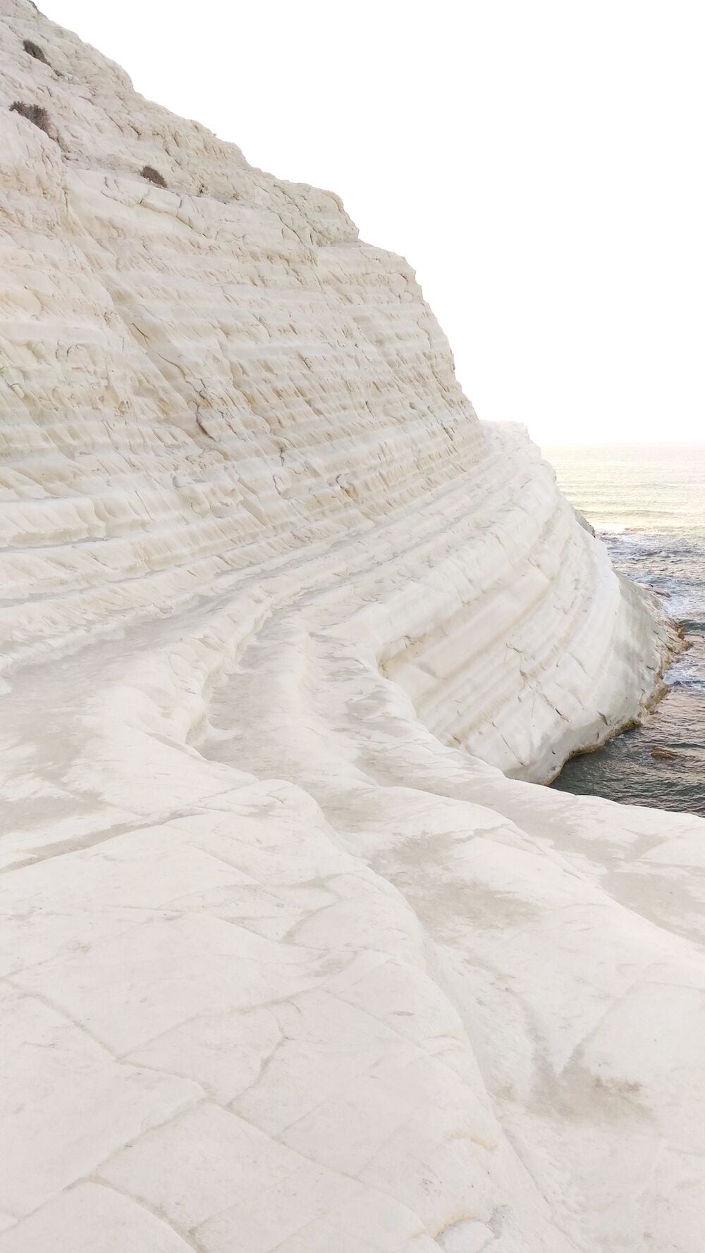One of the most unusual beaches you'll see! Located in the southern coast of Sicily near town Porto Empedocle this beach features white rocky cliff in the form of "stair" which you can climb. Come early to enjoy it all for yourself! #EndlessSummer #Italy #Sicily