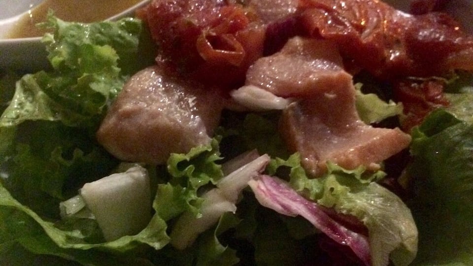 Green salad with a Brazilian fish