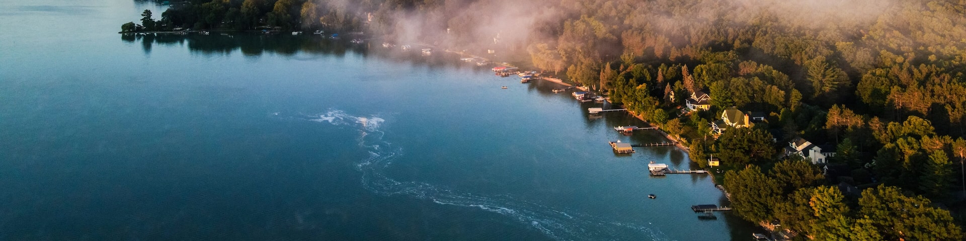 Aerial view of Wallon Lake coastline in Michigan on a cool summer morning